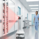 Keonn AdvanRobot using red laser fan-scanning to perform automated RFID inventory in a sterile hospital corridor.
